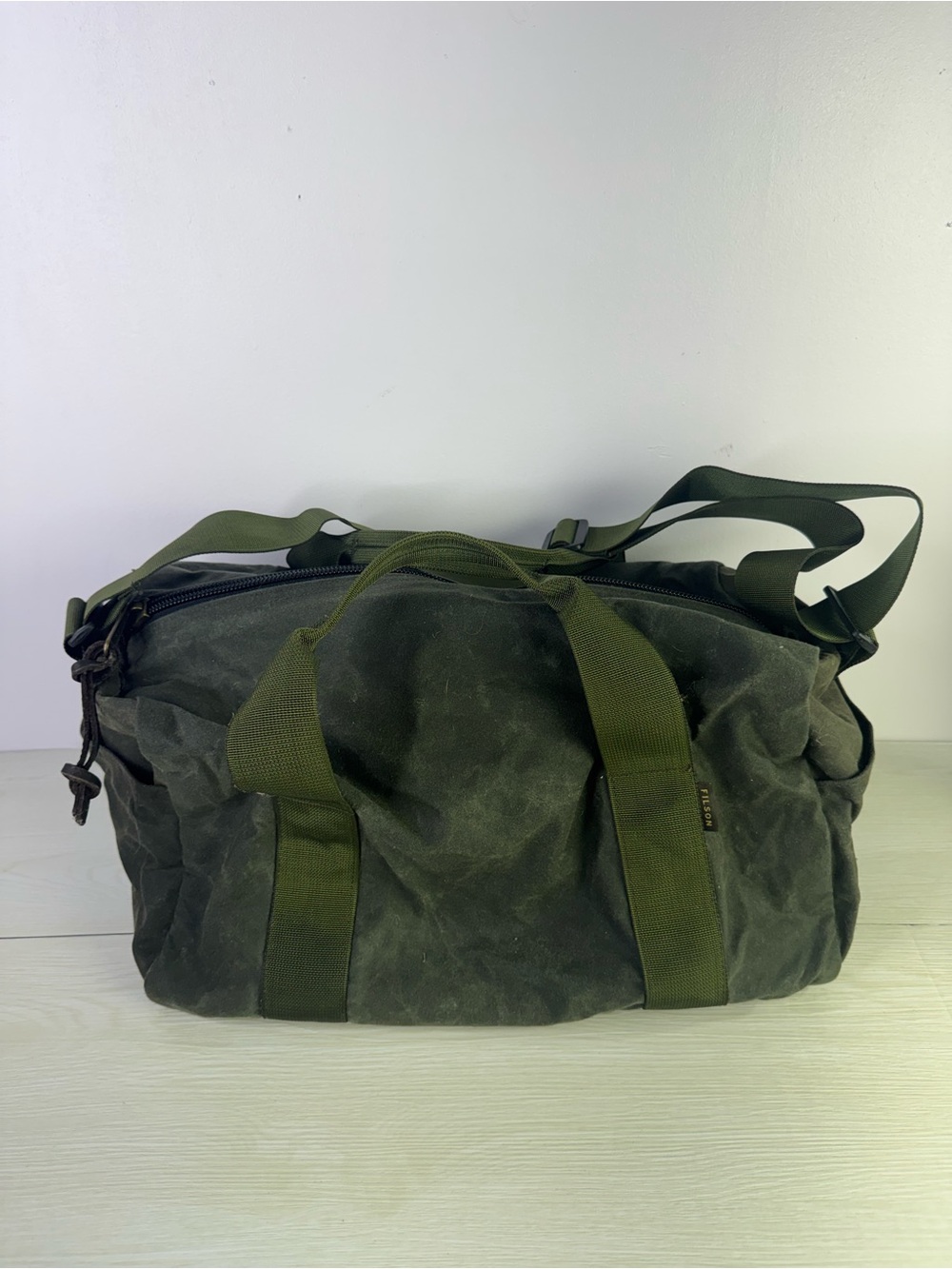 Filson Small Tin Cloth Duffle Bag in spruce green.